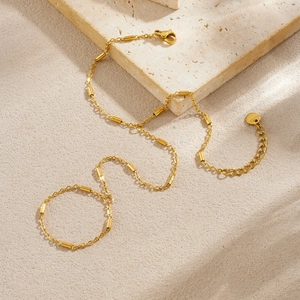 Minimalist gold-plated stainless steel chain ring bracelet with cylinder beads on stone base