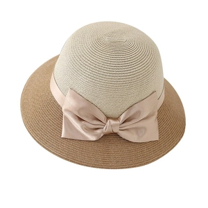 Elegant wide-brim bicolor straw sun hat with champagne gold bow for summer travel
