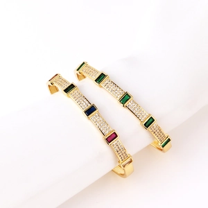 Luxurious gold-plated brass bangles featuring geometric micro-pave colored zircon stones
