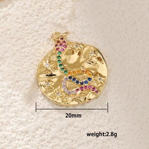 Macro detail of 20mm gold plated snake pendant with colorful zircons and moon texture