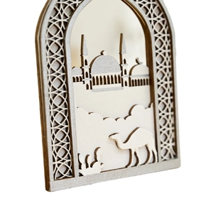 Carved wooden arch ornament with mosque and camel silhouette for festive home decoration