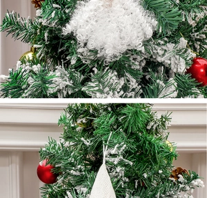 Detail view of snowy pine branches with red ornaments and festive gnome beard decor