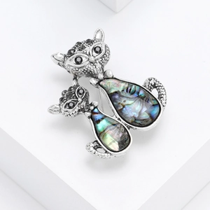Retro silver cat brooch with iridescent abalone shell inlay and black crystal accents