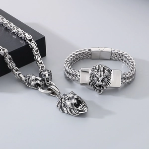 Detailed view of punk lion head necklace and bracelet set in polished stainless steel