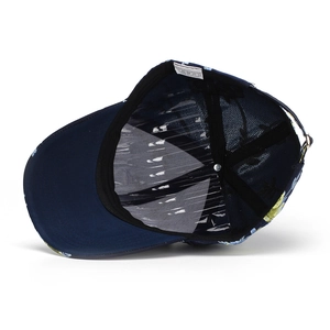 Detail of floral baseball cap interior featuring a sweatband and 100% polyester material label