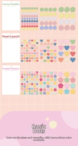 Macro detail of macaron-colored PET stickers in dot, heart, and floral shapes for journaling