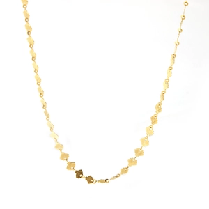 Detailed view of the 18K gold-plated necklace featuring delicate shell-shaped links