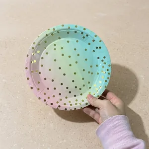 Detail of disposable gradient paper plate with golden foil polka dots for parties