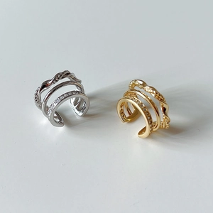 Detail of S925 silver ear cuffs with three-layer woven texture and zircon inlay