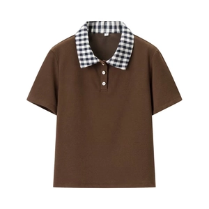 Close-up of polo shirt collar with plaid pattern and white flower-shaped buttons