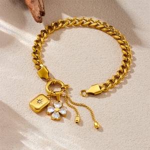 Gold plated Cuban chain bracelet with zircon heart and starburst square pendants