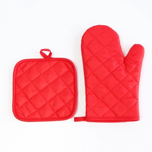 Red quilted oven mitt and pot holder set for kitchen baking, heat resistant and durable.