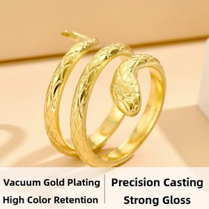 Detailed macro view of gold-plated snake ring featuring intricate scale textures and luster