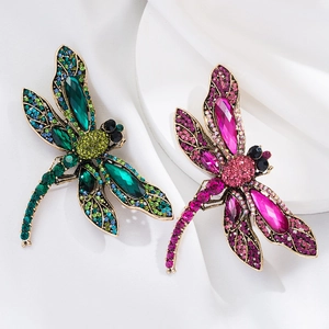 Vintage dragonfly brooch with colorful crystals and rhinestones in green and pink colors