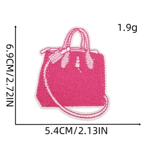 Pink handbag embroidery patch with 6.9cm height and 5.4cm width on white background