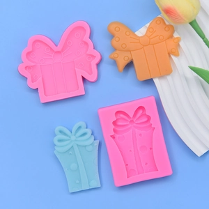 Gift box silicone mold set for bow-shaped cakes and chocolates with polka dot textures
