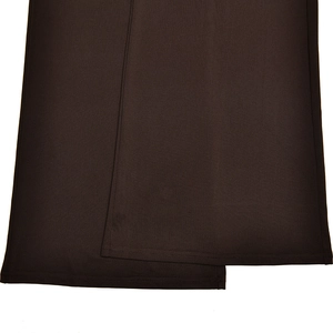 Detailed view of dark brown fabric texture and precise stitching on the flared pants set