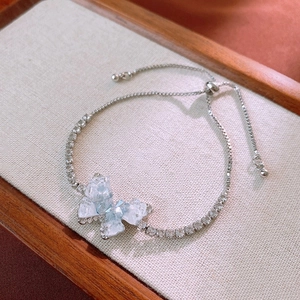 Detail of silver butterfly bracelet with light blue crystals and adjustable pull-cord