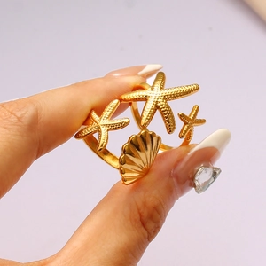 Golden starfish and seashell ocean themed open ring with realistic metal textures