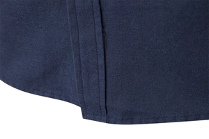 Macro view of navy blue shirt hem with high-density twill fabric and double stitching