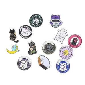 Collection of cartoon enamel cat pins with colorful designs and creative animal badges
