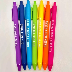 Close-up of funny pens with colorful matte finish and humorous English slang printing