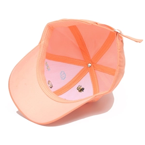 Interior view of orange kids baseball cap with cute embroidered cartoon bee detail