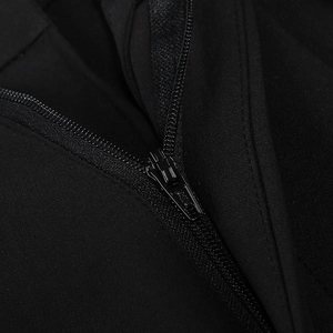 Macro detail of high-quality metal zipper and black fabric texture on casual suit jacket