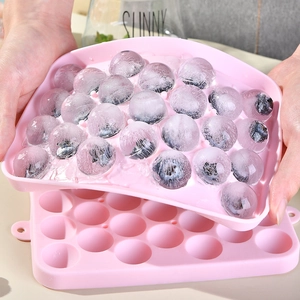 Pink silicone sphere ice cube tray with 25 holes and lid for fruit-filled ice balls