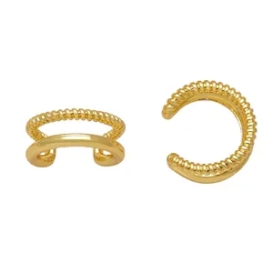 Close-up of vintage gold double-layer ear cuff featuring rope texture and smooth finish
