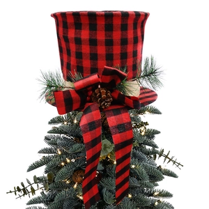 Detail of red and black plaid Christmas tree topper with pine cones and decorative bow
