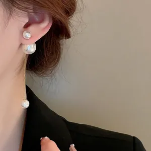 Elegant gold plated long pearl tassel earrings with three descending pearls for women