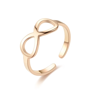 Macro shot of rose gold infinity ring with adjustable open band and polished finish