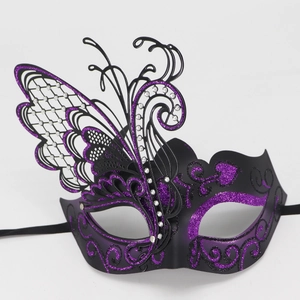 Close-up of luxury purple butterfly masquerade mask with glitter and rhinestones