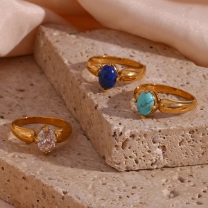 Three vintage 18K gold plated petal rings with colorful blue and turquoise gemstones