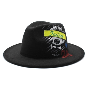 Classic black wide-brim wool fedora hat featuring artistic graffiti skull and yellow print