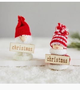 Detail of wool felt Santa and snowman figurines with wood Christmas sign decor