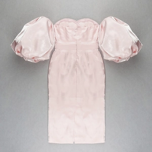 Detail of pink satin off-shoulder dress featuring dramatic puffy sleeves and silk texture