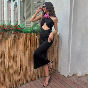 Elegant halter neck bodycon dress in black with a pink flower detail and cutout design