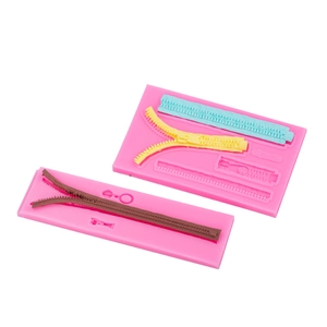 Pink silicone zipper mold for fondant cake decorating and DIY chocolate baking projects