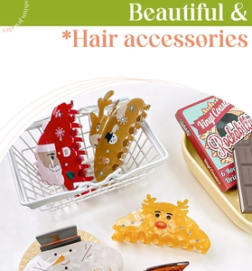 Detailed view of Christmas themed hair clips featuring Santa, reindeer and snowman designs