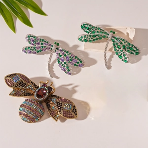 Vintage insect brooches with dragonfly and bee designs in colorful crystal pave setting