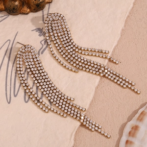 Close-up of 18K gold plated tassels with micro-pave cubic zirconia on earrings