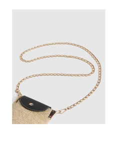 Detailed view of straw-woven mobile phone bag with black leather flap and gold chain