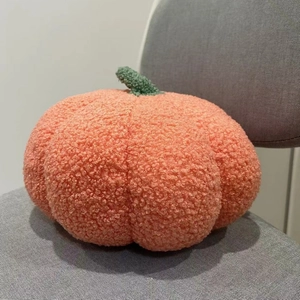 Orange pumpkin shaped plush pillow made of soft lamb wool fabric for home decor