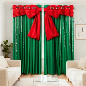 Detail view of green Christmas curtains with red bows and white bead lace trim