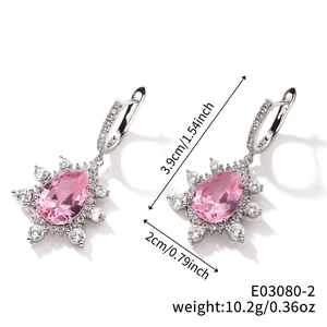 Detail showing dimensions of silver earrings with pear-cut pink stones and halo design