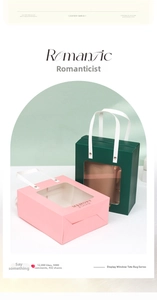 Detail of premium paper gift bags with transparent PVC window and white leather handles