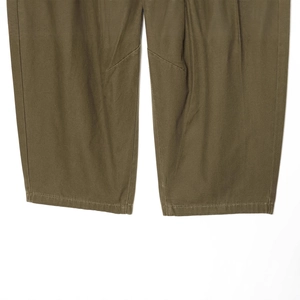 Olive green cotton canvas cargo pants featuring durable stitching and high-quality fabric texture
