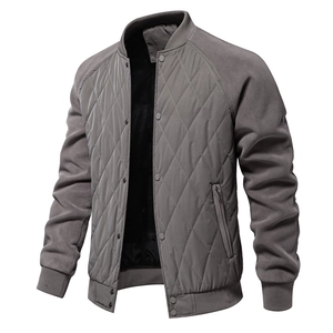 Detail of grey quilted jacket with stand collar and soft fleece lining for warmth